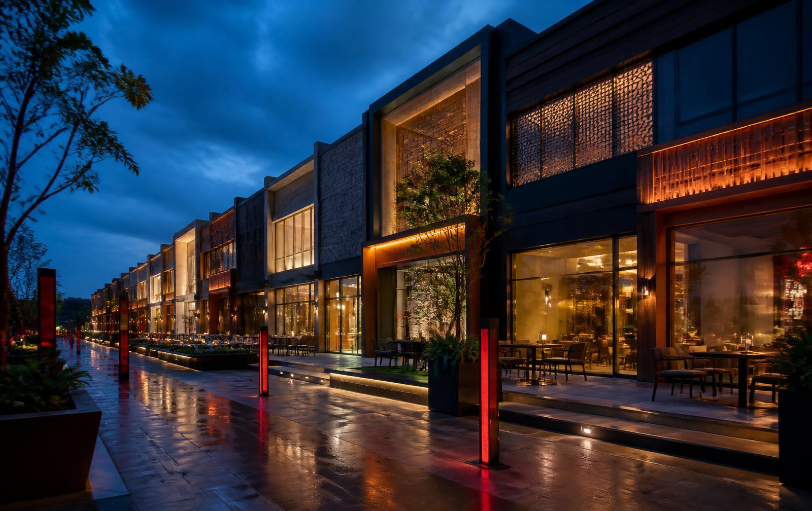 Premium retail promenade with illuminated storefronts at dusk